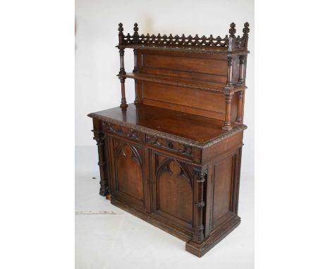 Victorian oak Gothic Revival side cabinet, circa 1875, the superstructure with pierced three-quarter gallery moulded with swa