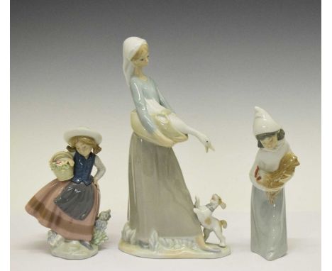 Two Lladro figures and a Nao figure of a women holding a goose, 28cm and smaller