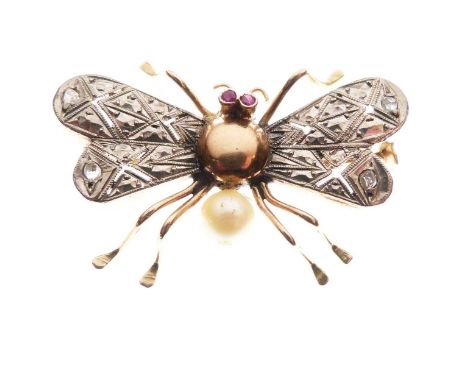 Brooch in the form of a butterfly, having ruby set eyes, the wings each set with two rose cut diamonds, unmarked yellow and w