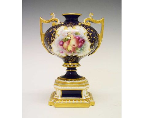 Royal Worcester twin-handled pedestal vase, shape 1958, painted with fruit by William Hawkins reserves on a cobalt blue groun