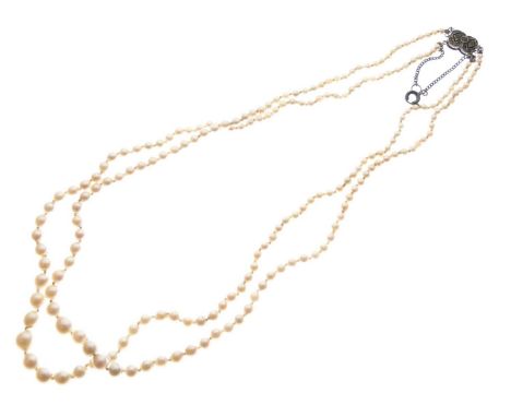 Two-row graduated cultured pearl necklace, the white metal paste set clasp stamped 'Made in France', approx 46cm long