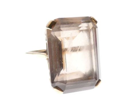 Smokey quartz ring, the rectangular stone set in a mount stamped '9ct', size O approx, 8.3g gross approx