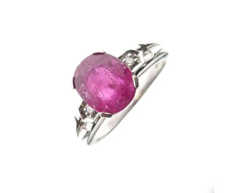 18ct white gold and ruby ring, having diamond set shoulders, the oval cut ruby 9mm x 7mm approx, size N approx, 4.6g gross ap