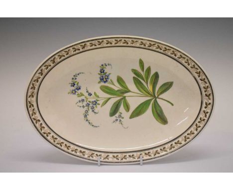 Early 19th Century Wedgwood cream ware oval dish, painted with a spray of Forget-Me-Not flowers within a leaf and berry borde
