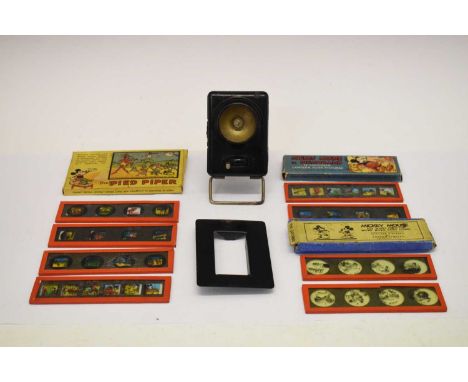 Three Walt Disney lantern slides comprising The Pied Piper, Mickey Mouse and Mickey Mouse in Pigmyland together with a Mickey