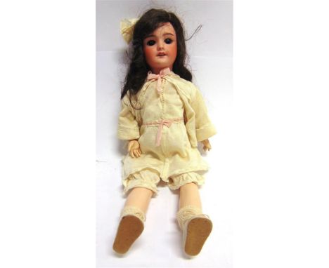 A SOCIETE FRANCAISE DE FABRICATION DE BEBES &amp; JOUETS BISQUE SOCKET HEAD DOLL  with a long dark brown wig, sleeping brown 