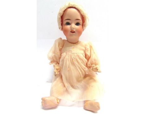 A WEIFEL &amp; CO. BISQUE SOCKET HEAD DOLL  with sleeping blue-grey glass eyes, and an open mouth with four upper teeth, on a