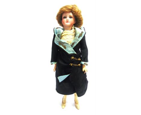 A SIMON &amp; HALBIG BISQUE SOCKET HEAD FASHION DOLL  with a brown wig, sleeping blue glass eyes, pierced ears and a closed, 