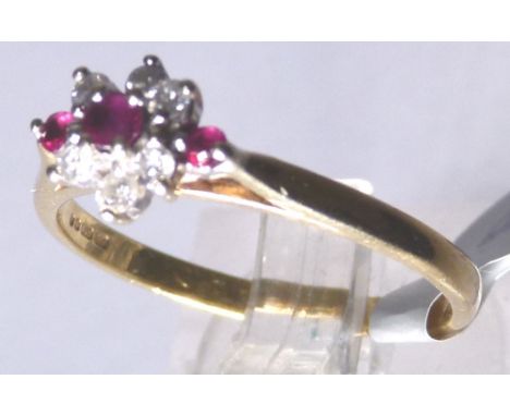 9 CT RUBY CLUSTER RING. 9 ct gold ruby and diamond cluster ring, size N