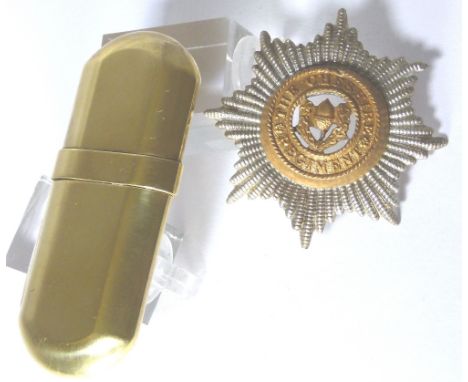 MILITARY BADGE & TRENCH ART. Cheshire Regiment metal hat badge and a brass no5 cigarette lighter