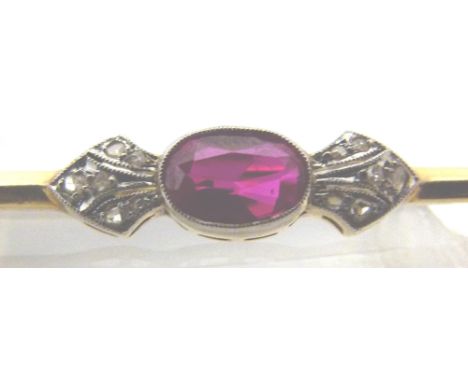 DIAMOND AND RUBY PIN. Diamond and ruby scarf pin on presumed gold 