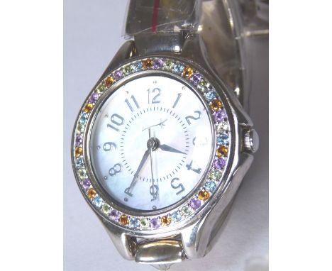 MULTI GEM SILVER WRISTWATCH. Multi gem hallmarked silver bangle style wristwatch with citrine, amethyst, peridot and topaz su