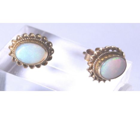 OPAL STUDS. 9ct gold opal stud earrings