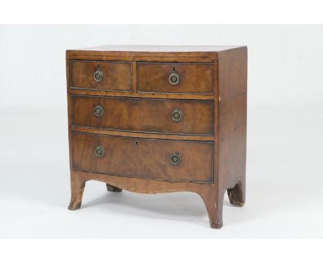 Unusually small mahogany bow front chest or apprentice piece, fitted with two short and two long drawers with cast brass ring