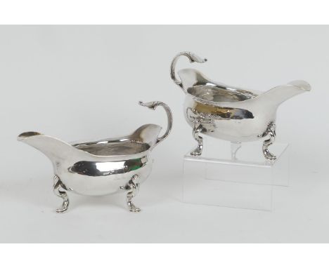 Pair of Edwardian silver sauceboats, by William Comyns, London 1902, of good gauge, engraved with a crest and motto, raised o