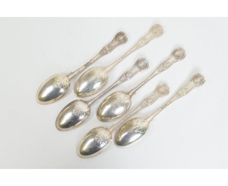 Six late Victorian and Edwardian silver Queens pattern table spoons, each engraved with an arm and dagger crest, comprising t