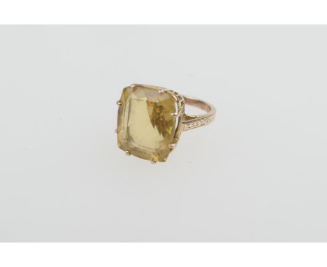 Citrine dress ring, the stone untested, of cushion shape, 14mm x 12mm, on an unmarked yellow gold split shank ring, size I, g