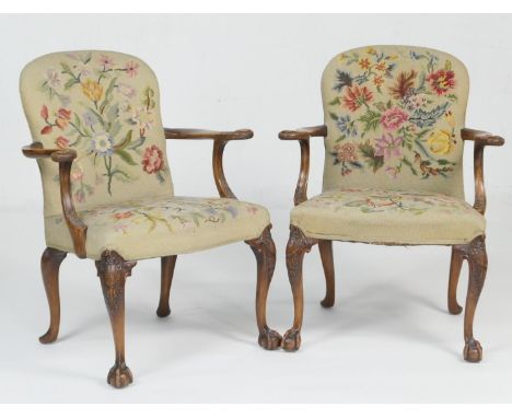 Pair of walnut and upholstered open armchairs, in the early Georgian style, the back and seat in foliate gross-point tapestry