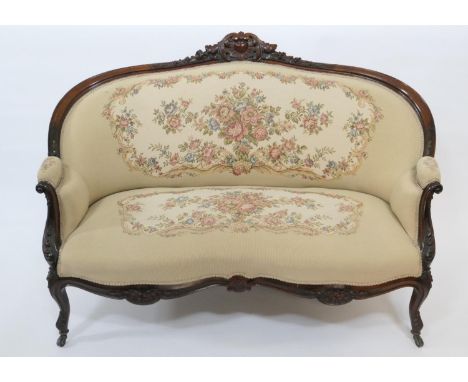 Victorian carved mahogany and upholstered canape, circa 1860,  with acanthus and foliate carved cresting rail, upholstered ba