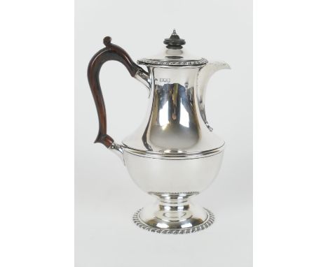 Late Victorian silver hot water jug, London hallmark, date rubbed but probably 1898, plain baluster form with ebony finial an