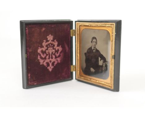 Victorian ambrotype photograph of a gentleman seated, in original vulcanite case, 9.5cm 