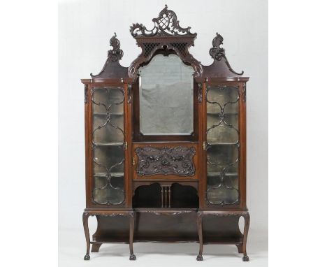 Victorian carved mahogany display cabinet, in the Rococo Revival style, circa 1890, having acanthus carved crest of a central