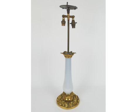 French gilt ormolu and milk glass table lamp, worked around the base with chrysanthemums, height to the top of the electrical