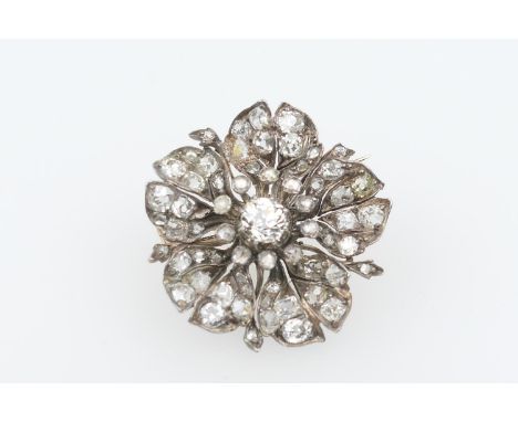 Victorian diamond flowerhead brooch, the central old cushion cut diamond of approx. 0.5ct, bordered with diamond mounted stam
