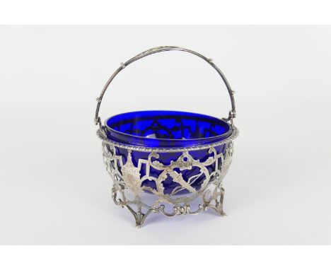 George V silver sugar basket, by Goldsmiths &amp; Silversmiths Company, London 1912, circular form with swing handle and blue