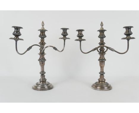 Pair of Victorian silver plated candelabra, each with two S-shaped branches and central sconce, over a multi knopped column a