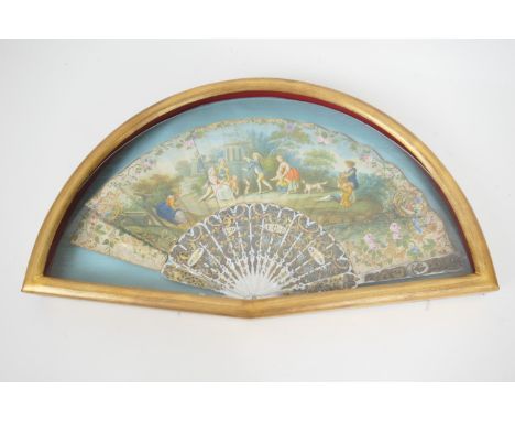 French mother of pearl and paper fan, early 19th Century, hand decorated with a scene of children playing within a classical 