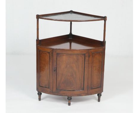 Late George III mahogany and ebony inlaid corner washstand, the top with a faux grey marble inset, the base with a central re