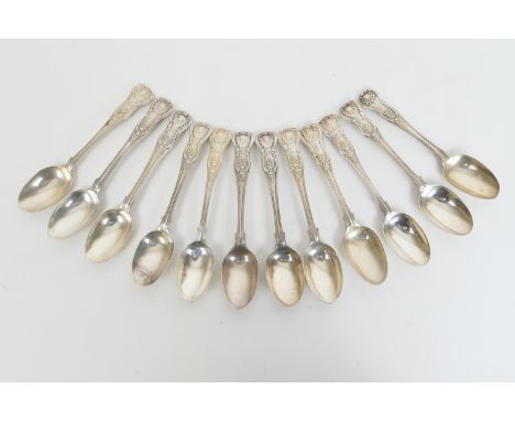 Twelve Victorian and later silver Queens pattern teaspoons, engraved with a monogram and an arm and dagger crest, comprising 