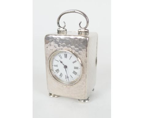 Late Victorian silver miniature carriage clock, Birmingham 1900, hammered form, white enamelled dial with Roman numerals, the