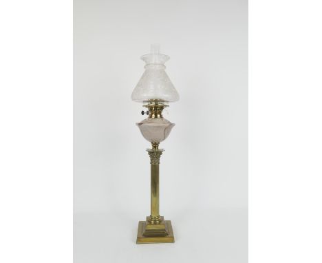 Brass  Corinthian column table lamp, with a conical shade etched with birds, butterflies and foliage, over a smoked glass tan