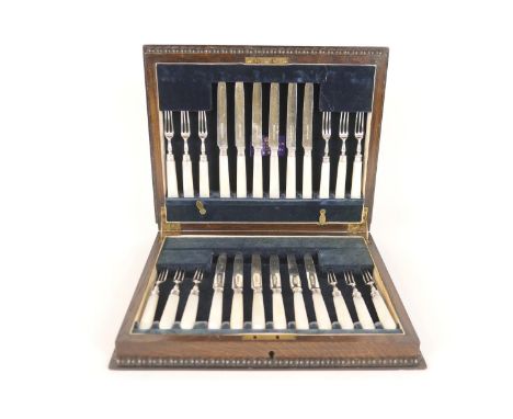 George V canteen of silver and mother of pearl dessert knives and forks, Sheffield 1934, twelve place settings, presented in 
