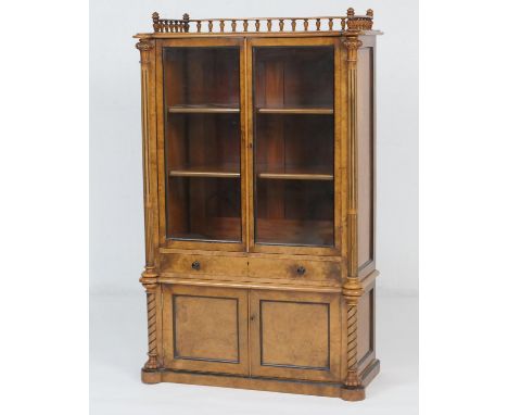 Victorian burr walnut display cabinet, circa 1875, having three-quarter gallery back over two glazed doors opening to shelves