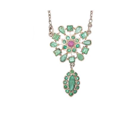 EMERALD AND RUBY PENDANT, set with mixed cut emeralds and a single ruby, in white metal