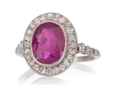 IMPRESSIVE UNHEATED BURMESE RUBY AND DIAMOND RING, the cushion cut Burma ruby of approximately 2.70 carats, within a halo of 