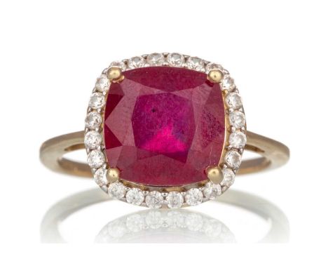SYNTHETIC RUBY AND GEM SET RING, the cushion shaped synthetic ruby within a halo of clear gems, in nine carat gold, size QQty