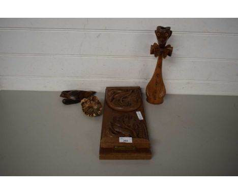 MIXED LOT COMPRISING CARVED WOODEN BOOK SLIDE, A NOVELTY WOODEN CANDLESTICK AND TWO FURTHER WOODEN ORNAMENTS (4)