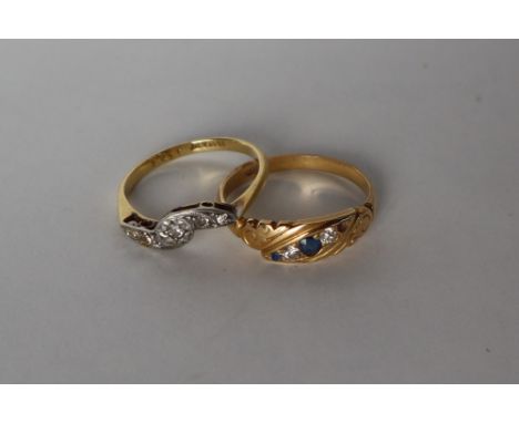 A five stone diamond ring set with old round cut diamonds to an 18ct gold shank together with a sapphire and diamond ring to 