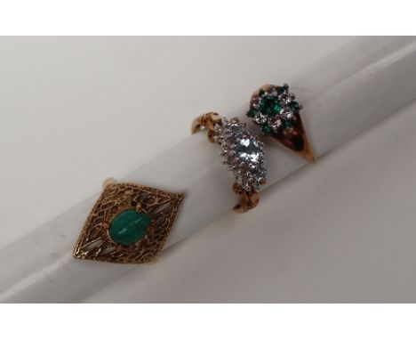 A 9ct gold ring set with a green cabochon stone, size N together with two other 9ct gold dress rings overall approximately 11