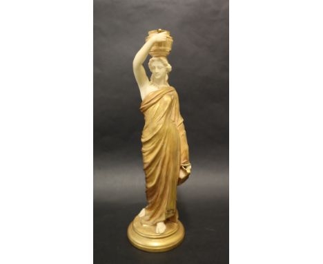 A Royal Worcester porcelain figure "The Water Carrier", depicting a maiden with a twin handled vessel on her head in a gilt t