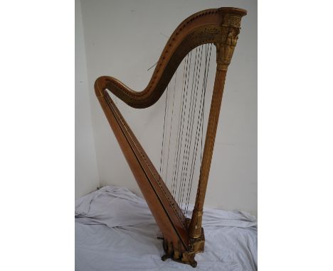 A Grecian Harp by Sebastian Erard, with a frieze of winged figures above three angel type figures and anthemions surmounting 
