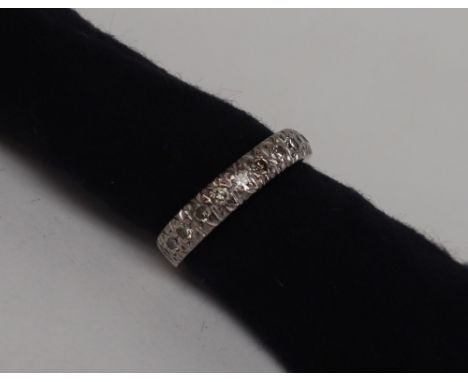 A Diamond half eternity ring set with twelve round old cut diamonds to a white metal setting and shank, size N, approximately