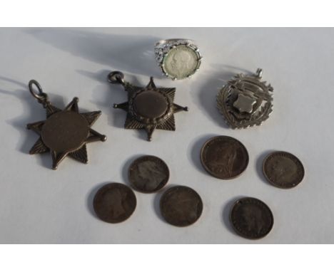 A collection of silver medallions together with a 1932 three pence coin in a silver ring mount and three pence pieces and a s