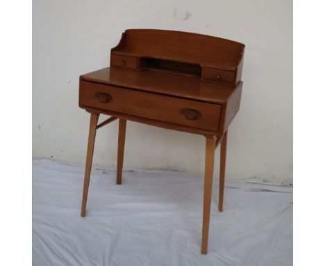 An Ercol writing desk, with a raised superstructure with a shelf, pigeon hole and drawers, the base with a drawer on square t