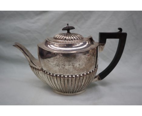 An Edward VII silver teapot, of oval form with a part reeded body, Birmingham, 1906, WA, approximately 575 grams