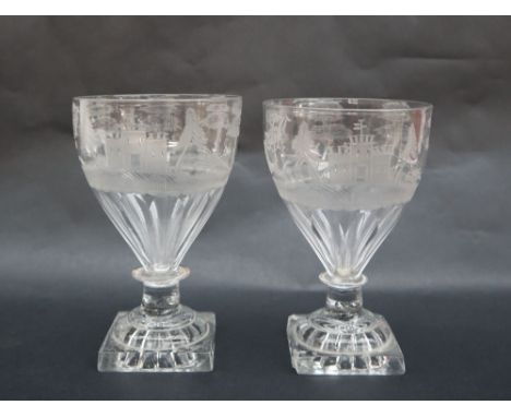 A pair of continental glass rummers the tapering bowl decorated with hunting scenes, on a ring turned stem and square base, 1